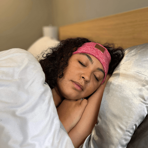 Pink Dormi Dream headband worn while sleeping on side